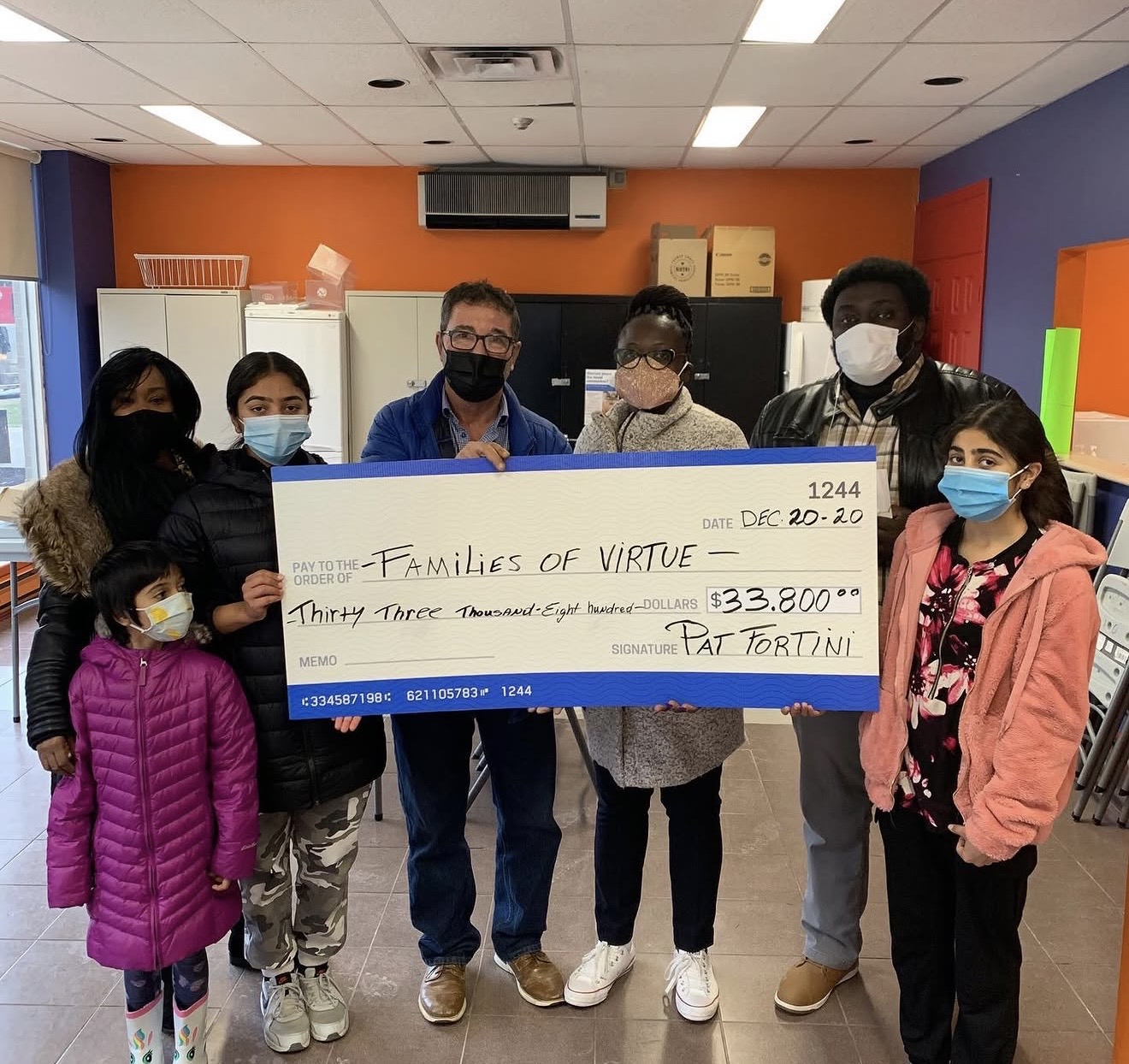 Pat Fortini presenting a $33,800 cheque to Families of Virtue