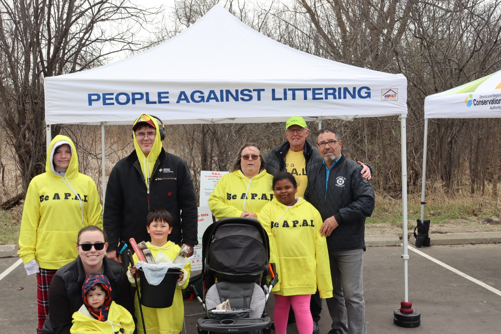 Pat Fortini with volunteers under a People Against Littering tent